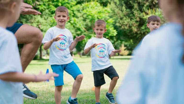 Joyful kids engaging in playful activities in a sunny park, enjoying summer fun together.
